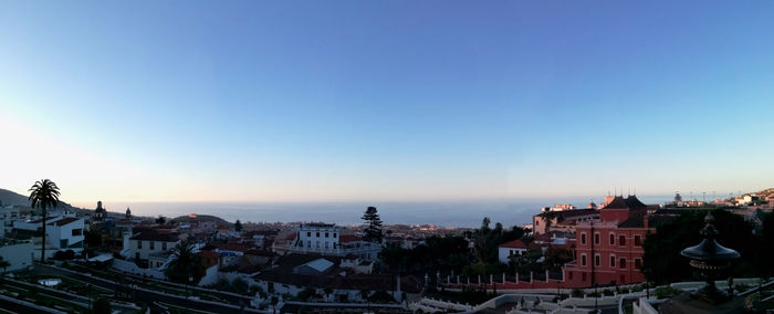 High angle shot of townscape against clear blue sky