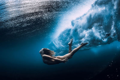 Woman swimming in sea