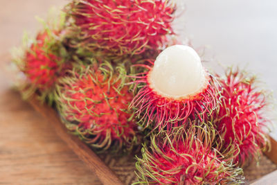 Close-up of rambutans in tray on table