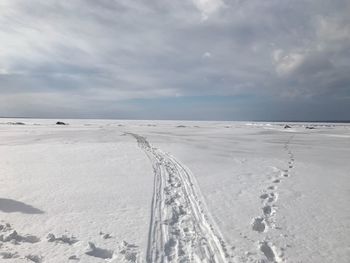 Scenic view of snow covered landscape against sky