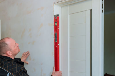 Side view of man working at home