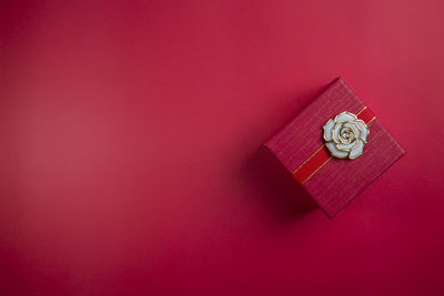 High angle view of clock on pink wall