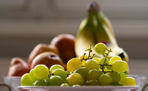 Close-up of grapes on table