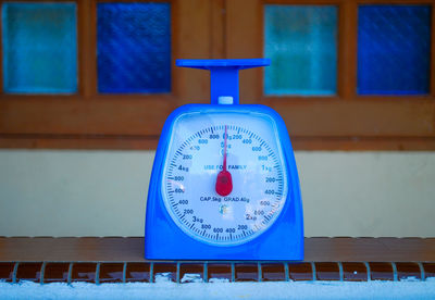 Close-up of weight scale on table