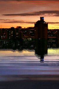 View of illuminated city at sunset