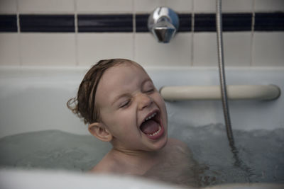 Close-up of girl in bathtub