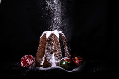 Close-up of strawberry over black background