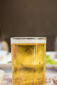 Close-up of beer glass on table