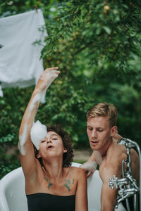 Young couple looking at plants