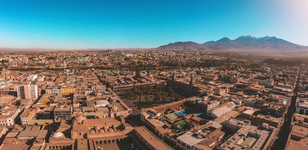 Aerial view of a sunset in arequipa city with chachani volcano as background, peru