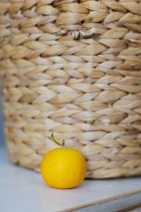 Close-up of oranges in wicker basket