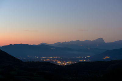 Scenic view of silhouette mountains against sky during sunset