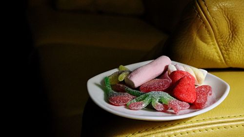 Close-up of strawberries in plate on table