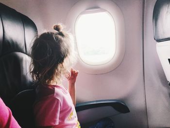 Girl sitting in airplane