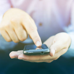Close-up of hand holding smart phone