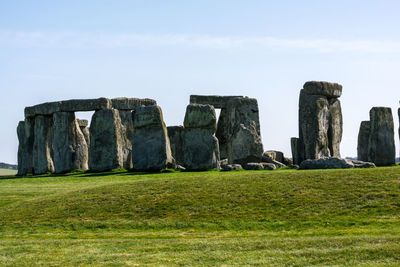 Built structure on field against sky