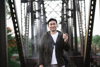 Portrait of young man standing outdoors