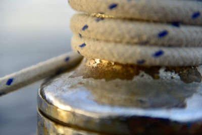 Close-up of rope tied up on metal