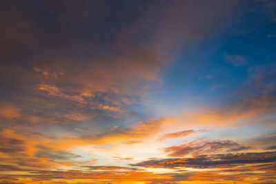 Low angle view of dramatic sky during sunset