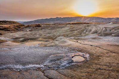 Scenic view of landscape against sky during sunset