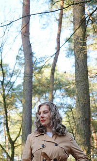 Thoughtful woman in forest