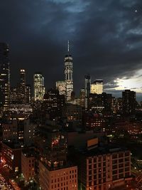 View of skyscrapers lit up at night