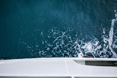 High angle view of boat sailing in sea