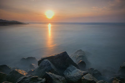 Scenic view of sea against sky during sunset