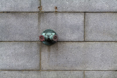 Fire hydrant water pipe, mounted in a building wall. manhattan usa