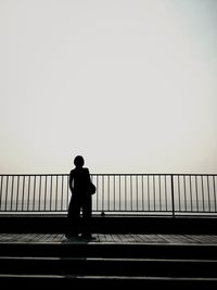 People standing by railing