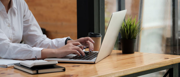 Man using laptop on table