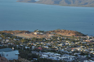 High angle view of townscape by sea