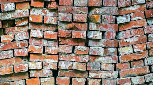 Pile of used red bricks