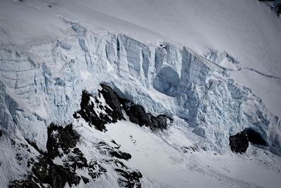 High angle view of snow covered land and mountains