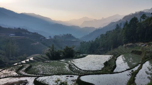 Scenic view of mountains against sky during sunset