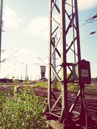 Electricity pylons on field