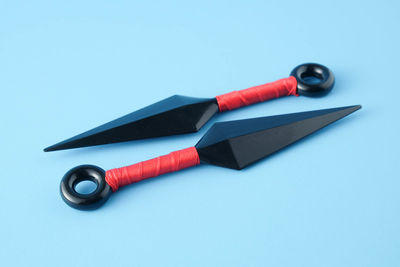 High angle view of pen on table against blue background