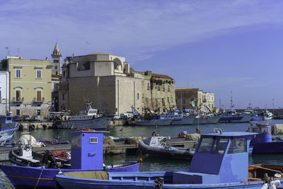 Boats moored at harbor