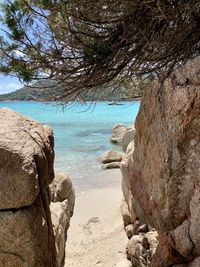 Rocks on beach against sky