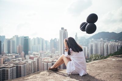 Full length of woman standing in city