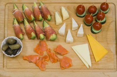 High angle view of fruits and vegetables on cutting board