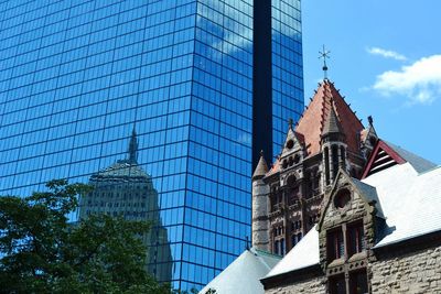 Low angle view of tower against blue sky