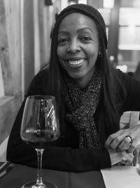 Portrait of a smiling young woman at restaurant