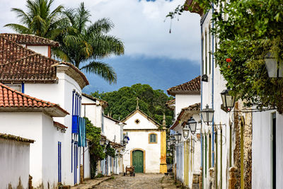 Old colonial street with church on overcast day