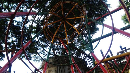 Low angle view of ferris wheel against sky