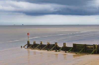 View of the humber estuary from cleethorpes beach with dark clouds