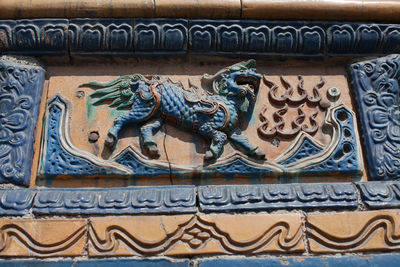 Close-up of carving on wall