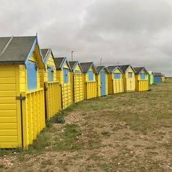 View of beach huts against sky