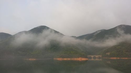 Scenic view of mountains in foggy weather
