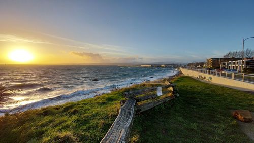 Scenic view of beach against sky during sunset